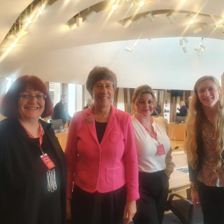 Group of women standing.