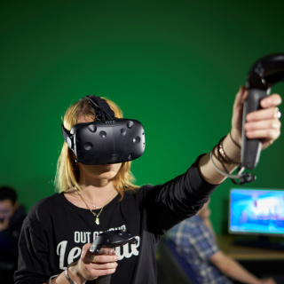 A woman wears a Virtual Reality headset