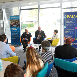 A photograph of a discussion